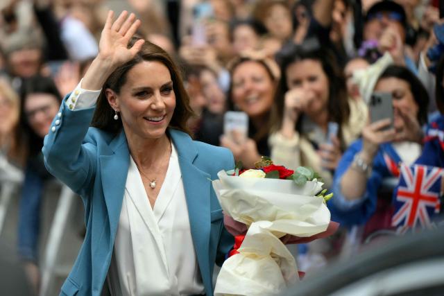 Britain's Catherine, Princess of Wales waves to the crowd as she leaves Reggio Emilia's town hall as part of a two-day visit in Italy, on May 13, 2026. (Photo by Marco BERTORELLO / POOL / AFP)