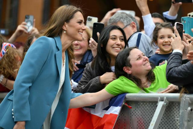 Britain's Catherine, Princess of Wales greets people outside Reggio Emilia's town hall as part of a two-day visit in Italy, on May 13, 2026. (Photo by Marco BERTORELLO / POOL / AFP)