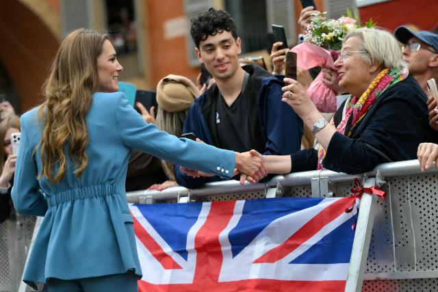 Britain's Catherine, Princess of Wales greets people outside Reggio Emilia's town hall as part of a two-day visit in Italy, on May 13, 2026. (Photo by Marco BERTORELLO / POOL / AFP)