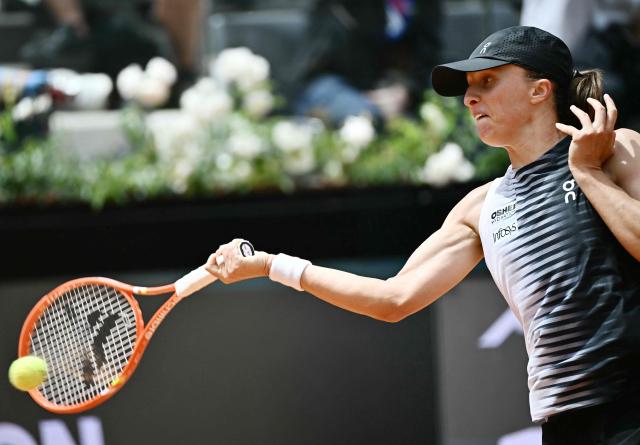 Poland's Iga Swiatek hits a return to USA's Jessica Pegula during the ATP Rome Open tennis tournament at Foro Italico in Rome on May 13, 2026. (Photo by Filippo MONTEFORTE / AFP)