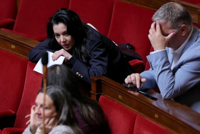 La France Insoumise - Nouveau Front Populaire's MP Sophia Chikirou (L) attends a session of questions to the government at The National Assembly, France's lower house of parliament in Paris on May 13, 2026. (Photo by Thomas SAMSON / AFP)
