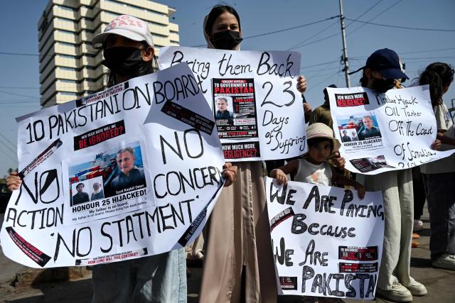 Families of Pakistan's crew members of an oil tanker seized by pirates in Somalia demonstrate during a protest near Karachi Port Trust (KPT) in Karachi on May 13, 2026, urging the government to ensure the safe return of their loved ones. (Photo by Rizwan TABASSUM / AFP)