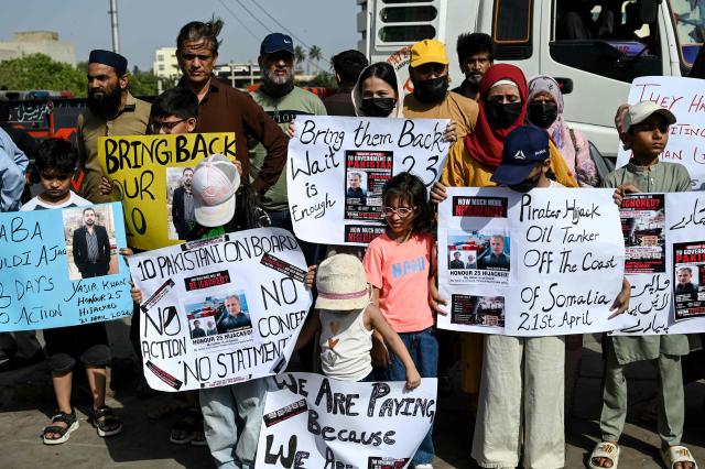 Families of Pakistan's crew members of an oil tanker seized by pirates in Somalia demonstrate during a protest near Karachi Port Trust (KPT) in Karachi on May 13, 2026, urging the government to ensure the safe return of their loved ones. (Photo by Rizwan TABASSUM / AFP)