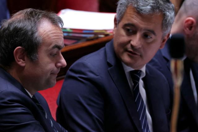 France's Prime Minister Sebastien Lecornu (L) and France's Justice Minister Gerald Darmanin attend a session of questions to the government at The National Assembly, France's lower house of parliament in Paris on May 13, 2026. (Photo by Thomas SAMSON / AFP)