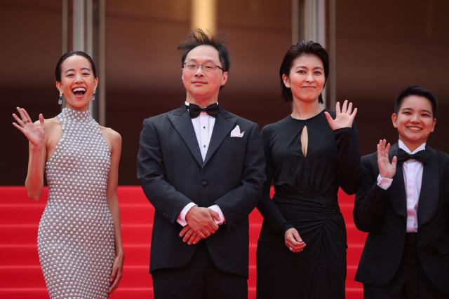 (From L) Japanese actress Shizuka Ishibashi, Japanese director, screenwriter, editor, and producer Koji Fukada, Japanese actress Takako Matsu and Thai co-Producer Si En Tan arrive for the screening of the film "Nagi Notes" at the 79th edition of the Cannes Film Festival in Cannes, southern France on May 13, 2026. (Photo by Valery HACHE / AFP)