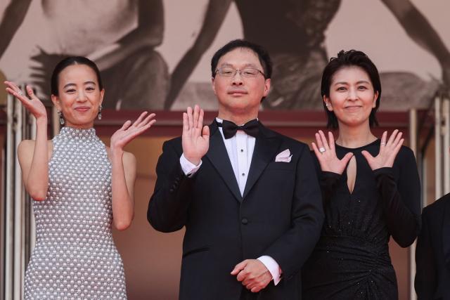 (From L) Japanese actress Shizuka Ishibashi, Japanese director, screenwriter, editor, and producer Koji Fukada and Japanese actress Takako Matsu arrive for the screening of the film "Nagi Notes" at the 79th edition of the Cannes Film Festival in Cannes, southern France on May 13, 2026. (Photo by Valery HACHE / AFP)