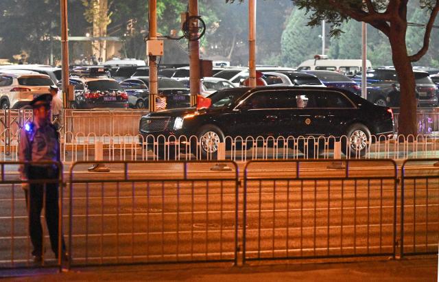 US President Donald Trump's motorcade arrives at the Four Seasons Hotel in Beijing on May 13, 2026. (Photo by Pedro PARDO / AFP)
