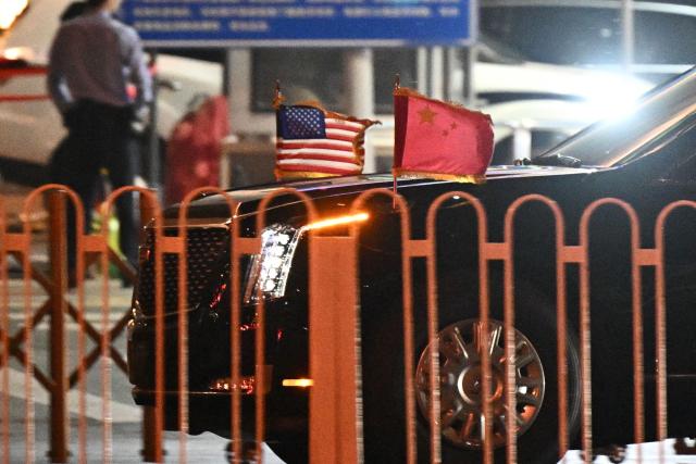US President Donald Trump's motorcade arrives at the Four Seasons Hotel in Beijing on May 13, 2026. (Photo by Pedro PARDO / AFP)