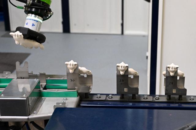 This photograph shows Sophie la girafe (Sophie the Giraffe) toys made by French baby care products and toys company Vulli in the production line of its new production site in Saint-Nabord, north-eastern France, on May 12, 2026. Vulli, which has made "Made in France" its hallmark, has admitted on May 4, 2026 manufacturing giraffe toys in China, as revealed in an investigation by the online media outlet Mediapart, but insists that this is a temporary situation. The French Directorate-General for Competition, Consumer Affairs and Fraud Control (DGCCRF) has launched an investigation as claiming a product to be of French origin when it is not may constitute a misleading commercial practise, punishable by a criminal fine of up to 10% of turnover. (Photo by Jean-Christophe VERHAEGEN / AFP)