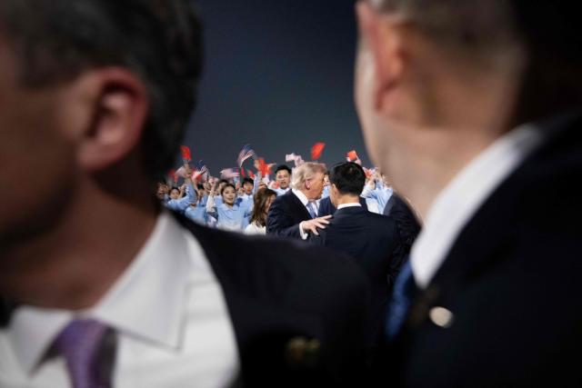 US President Donald J. Trump is greeted by China's Vice President Han Zheng and others as he arrives at the Beijing Capital International Airport May 13, 2026. (Photo by Brendan Smialowski / AFP)