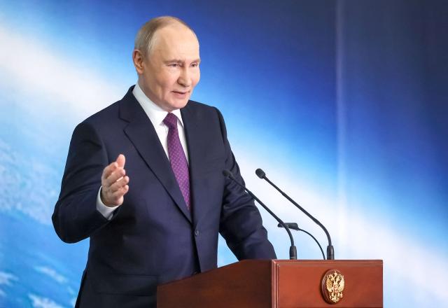 In this pool photograph distributed by the Russian state agency Sputnik, Russia's President Vladimir Putin gives a speech during a ceremony to award staff of the Moscow Institute of Thermal Technology - Russian ballistic missiles developer, on the outskirts of Moscow on May 13, 2026. (Photo by Vyacheslav PROKOFYEV / POOL / AFP)