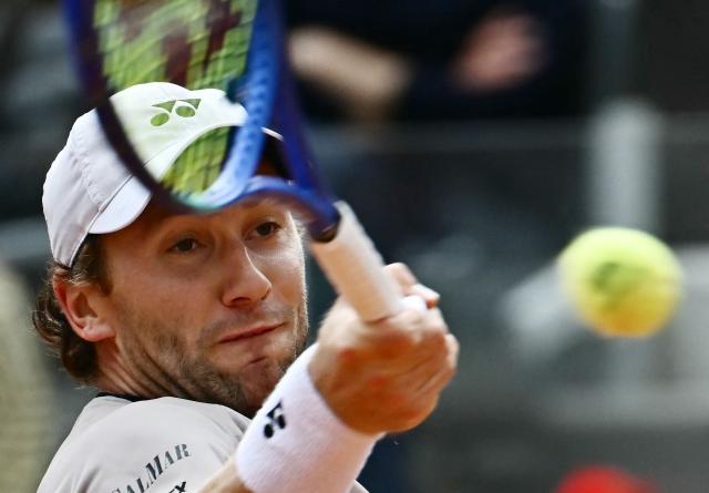 Norway's Casper Ruud hits a return to Russia's Karen Khachanov during the ATP Rome Open tennis tournament at Foro Italico in Rome on May 13, 2026. (Photo by Filippo MONTEFORTE / AFP)