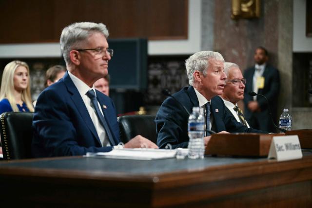 (L-R) Under Secretary of Energy for Nuclear Security and Administrator National Nuclear Security Administration Brandon M. Williams, US Energy Secretary Chris Wright and Assistant Secretary for the Office of Environmental Management at the US Department of Energy Timothy J. Walsh testify before a Senate Committee on Armed Services Committee hearing to examine the 2027 budget for the Department of Energy and National Nuclear Security Administration on Capitol Hill in Washington, DC, on May 13, 2026. (Photo by Jim WATSON / AFP)
