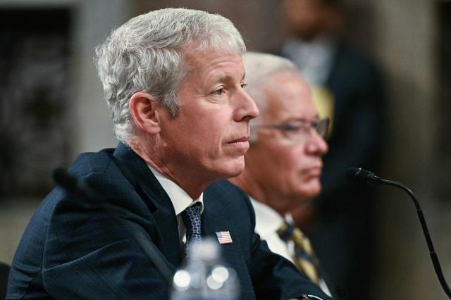 (L-R) US Energy Secretary Chris Wright and Assistant Secretary for the Office of Environmental Management at the US Department of Energy Timothy J. Walsh testify before a Senate Committee on Armed Services Committee hearing to examine the 2027 budget for the Department of Energy and National Nuclear Security Administration on Capitol Hill in Washington, DC, on May 13, 2026. (Photo by Jim WATSON / AFP)