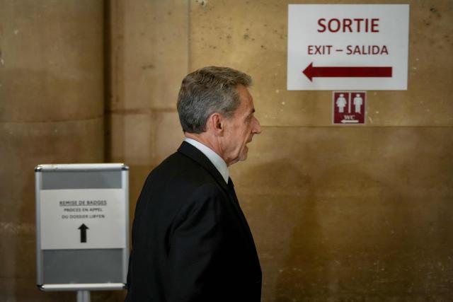 French former president Nicolas Sarkozy leaves the courtroom after prosecutors requested a seven-year prison sentence for him in an appeal trial on charges that he sought Libyan financing for his 2007 election in exchange for helping improve Tripoli's image after deadly bombing, at the Palais de Justice courthouse in Paris on May 13, 2026. Sarkozy has always denied any wrongdoing but last year became modern France's first former president to have gone to jail over the case, before he was released after 20 days pending his appeal trial. Prosecutors had also requested seven years in the first trial, and he was sentenced to five over seeking to acquire funding from Muammar Gaddafi's Libya for the campaign. (Photo by Dimitar DILKOFF / AFP)