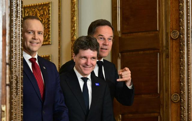 (L-R) Poland's President Karol Nawrocki, Romania's President Nicusor Dan and NATO Secretary General Mark Rutte arrive to give a press conference at the summit of the Bucharest Nine (B9) and the Nordic countries at the Cotroceni Palace in Bucharest, Romania on May 13, 2026. The event is co-chaired by the President of Romania and the President of Poland under the overarching theme of 'Delivering More for Transatlantic Security' and is focusing on transatlantic security and NATOs forthcoming summit in Ankara. The B9 format, also known as NATO's Eastern Flank, includes Bulgaria, the Czech Republic, Estonia, Hungary, Latvia, Lithuania, Poland, Romania and Slovakia. (Photo by Daniel MIHAILESCU / AFP)