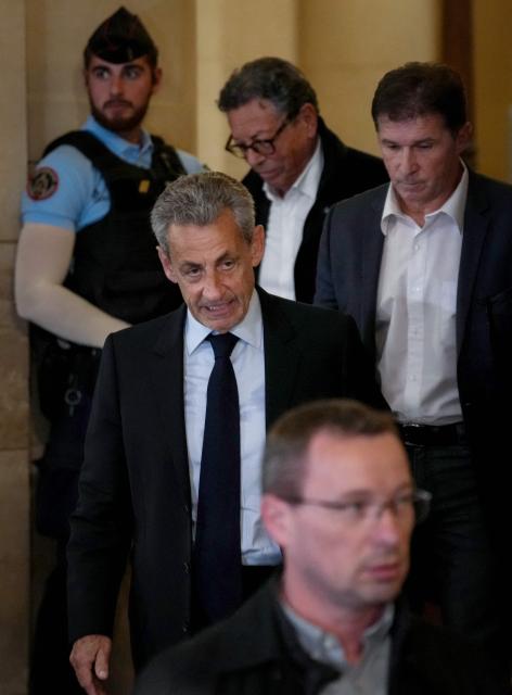 French former president Nicolas Sarkozy leaves the courtroom after prosecutors requested a seven-year prison sentence for him in an appeal trial on charges that he sought Libyan financing for his 2007 election in exchange for helping improve Tripoli's image after deadly bombing, at the Palais de Justice courthouse in Paris on May 13, 2026. Sarkozy has always denied any wrongdoing but last year became modern France's first former president to have gone to jail over the case, before he was released after 20 days pending his appeal trial. Prosecutors had also requested seven years in the first trial, and he was sentenced to five over seeking to acquire funding from Muammar Gaddafi's Libya for the campaign. (Photo by Dimitar DILKOFF / AFP)