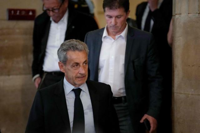French former president Nicolas Sarkozy leaves the courtroom after prosecutors requested a seven-year prison sentence for him in an appeal trial on charges that he sought Libyan financing for his 2007 election in exchange for helping improve Tripoli's image after deadly bombing, at the Palais de Justice courthouse in Paris on May 13, 2026. Sarkozy has always denied any wrongdoing but last year became modern France's first former president to have gone to jail over the case, before he was released after 20 days pending his appeal trial. Prosecutors had also requested seven years in the first trial, and he was sentenced to five over seeking to acquire funding from Muammar Gaddafi's Libya for the campaign. (Photo by Dimitar DILKOFF / AFP)
