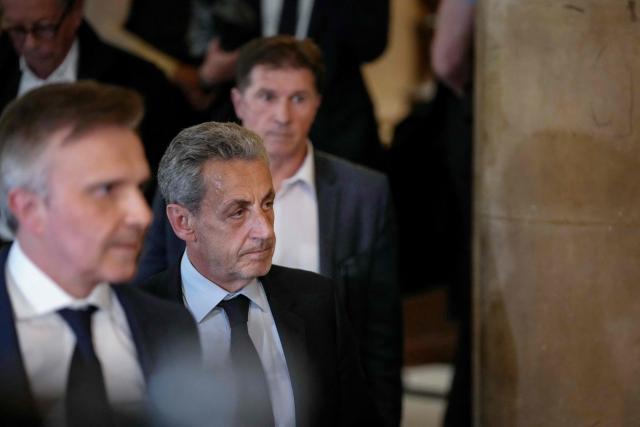 French former president Nicolas Sarkozy leaves the courtroom after prosecutors requested a seven-year prison sentence for him in an appeal trial on charges that he sought Libyan financing for his 2007 election in exchange for helping improve Tripoli's image after deadly bombing, at the Palais de Justice courthouse in Paris on May 13, 2026. Sarkozy has always denied any wrongdoing but last year became modern France's first former president to have gone to jail over the case, before he was released after 20 days pending his appeal trial. Prosecutors had also requested seven years in the first trial, and he was sentenced to five over seeking to acquire funding from Muammar Gaddafi's Libya for the campaign. (Photo by Dimitar DILKOFF / AFP)