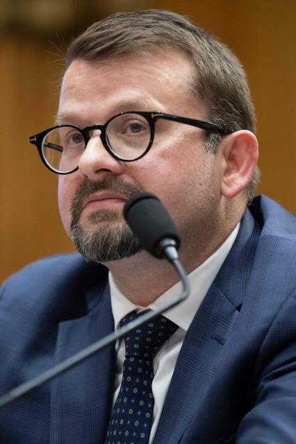 James Erdman III, senior operations officer at the CIA, testifies during a Senate Homeland Security and Governmental Affairs Committee hearing on Capitol Hill in Washington, DC, on May 13, 2026. Erdman testified that he believes there was an effort within the Intelligence Community to downplay the possibility that the COVID-19 pandemic originated in a "lab leak." (Photo by Jim WATSON / AFP)