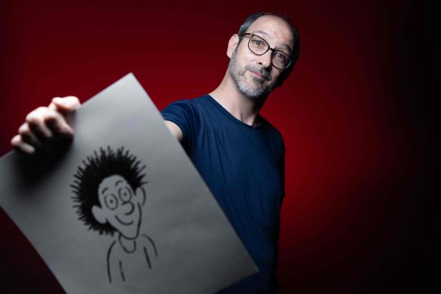 French cartoonist and co-creator of the comic strip "Anatole Latuile", Clement Devaux poses during a photo session in Paris on May 12, 2026. (Photo by JOEL SAGET / AFP)