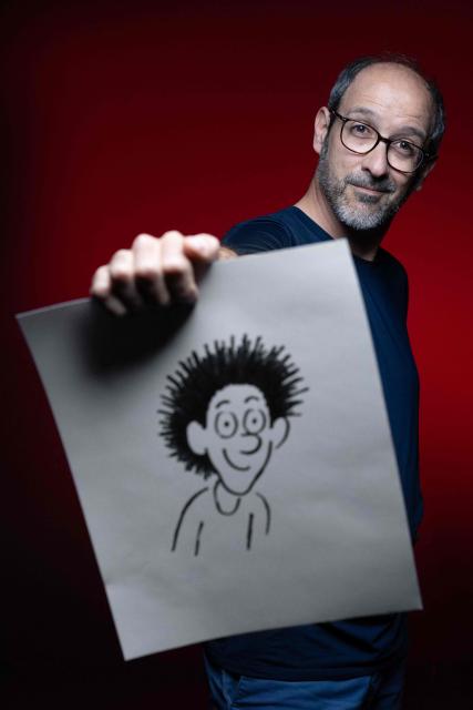 French cartoonist and co-creator of the comic strip "Anatole Latuile", Clement Devaux poses during a photo session in Paris on May 12, 2026. (Photo by Joel Saget / AFP)