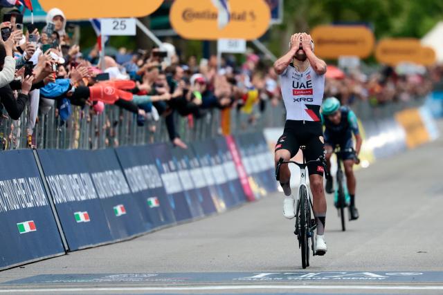 TOPSHOT - UAE Team Emirates - XRG Spanish rider Igor Arrieta celebrates as he crosses the finish line to win the 5th stage of the Giro d'Italia 2026 - Tour of Italy cycling race between Praia a Mare and Potenza, southern Italy on May 13, 2026. (Photo by Luca BETTINI / AFP)