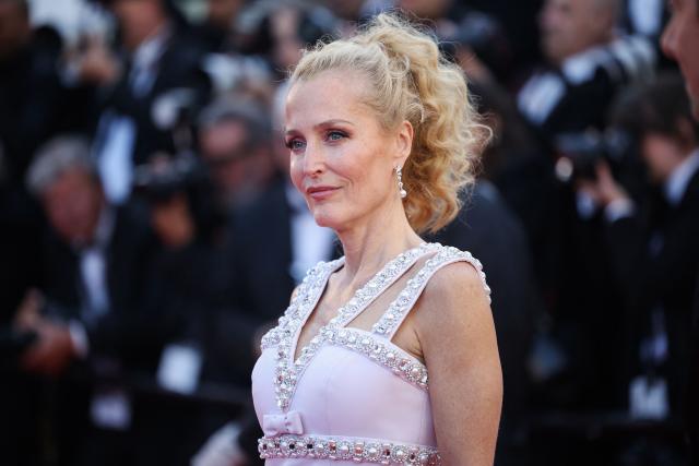 US actress Gillian Anderson arrives for the screening of the film "Teenage Sex and Death at Camp Miasma" at the 79th edition of the Cannes Film Festival in Cannes, southern France on May 13, 2026. (Photo by Valery HACHE / AFP)