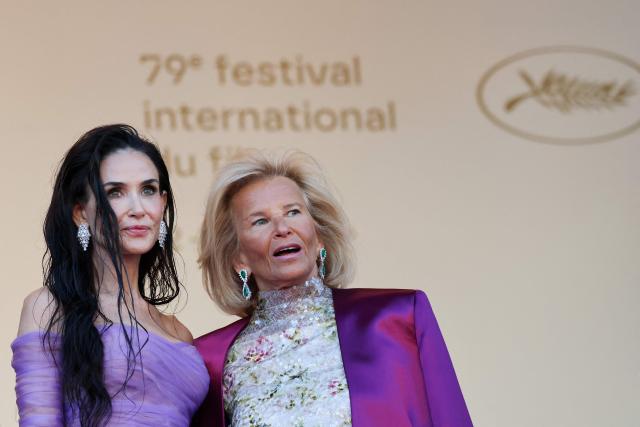 Member of the jury US actress and producer Demi Moore and President of the Cannes Film Festival Iris Knobloch arrive for the screening of the film "La Vie d'une femme" (A Woman's Life) at the 79th edition of the Cannes Film Festival in Cannes, southern France on May 13, 2026. (Photo by Thibaud MORITZ / AFP)