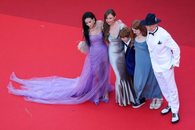 US actress Demi Moore (L), US director Rebecca Harrell Tickell (2ndL) and US director Joshua Tickell (R) arrive for the screening of the film "Groundswell" at the 79th edition of the Cannes Film Festival in Cannes, southern France on May 13, 2026. (Photo by Sameer AL-DOUMY / AFP)