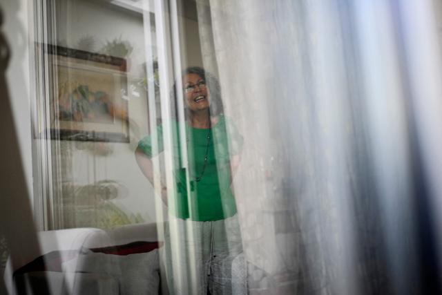 Former Sandinista National Liberation Front (FSLN) guerrilla commander Monica Baltodano is seen through curtains after an interview with AFP at her home in San Jose on May 10, 2026. Nicaragua’s co-president, Rosario Murillo, will not remain in power after Daniel Ortega’s death, said former guerrilla commander Baltodano in an interview with AFP whilst in exile in Costa Rica. (Photo by MARTIN BERNETTI / AFP)
