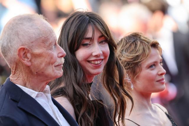 (From L) Italian writer Erri de Luca, French actress Suzanne De Baecque and French actress Melanie Thierry arrive for the screening of the film "La Vie d'une femme" (A Woman's Life) at the 79th edition of the Cannes Film Festival in Cannes, southern France on May 13, 2026. (Photo by Thibaud MORITZ / AFP)