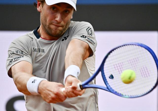 Norway's Casper Ruud hits a return to Russia's Karen Khachanov during the ATP Rome Open tennis tournament at Foro Italico in Rome on May 13, 2026. (Photo by Filippo MONTEFORTE / AFP)