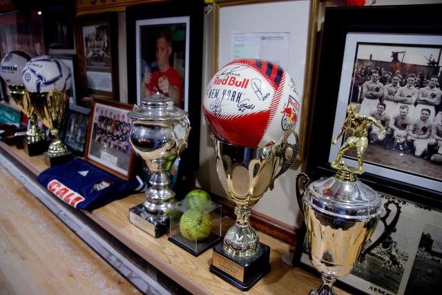 View of the trophy shelf at the Scots American Club in Kearny, New Jersey on May 9, 2026. Anthony Duro had hoped the World Cup coming to his soccer-mad New Jersey town would mean watching games at nearby MetLife Stadium, but sky-high ticket prices are beyond his budget. (Photo by Leonardo MUNOZ / AFP) / TO GO WITH AFP STORY BY BEN TURNER