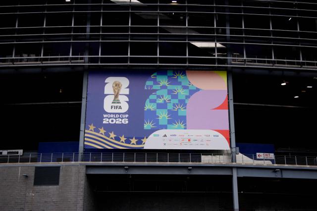 A “FIFA World Cup 2026” banner is displayed at the MetLife Stadium in East Rutherford, New Jersey on May 9, 2026. Anthony Duro had hoped the World Cup coming to his soccer-mad New Jersey town would mean watching games at nearby MetLife Stadium, but sky-high ticket prices are beyond his budget. (Photo by Leonardo MUNOZ / AFP) / TO GO WITH AFP STORY BY BEN TURNER