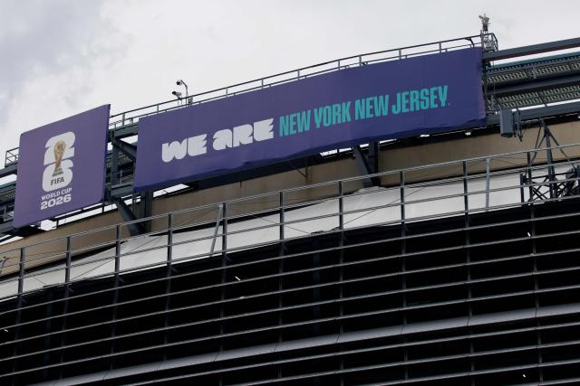 A “We are New York New Jersey” banner is displayed at the MetLife Stadium in East Rutherford, New Jersey on May 9, 2026. Anthony Duro had hoped the World Cup coming to his soccer-mad New Jersey town would mean watching games at nearby MetLife Stadium, but sky-high ticket prices are beyond his budget. (Photo by Leonardo MUNOZ / AFP) / TO GO WITH AFP STORY BY BEN TURNER