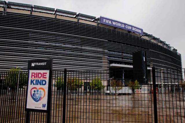 A “FIFA World Cup 2026” banner is displayed at the MetLife Stadium in East Rutherford, New Jersey on May 9, 2026. Anthony Duro had hoped the World Cup coming to his soccer-mad New Jersey town would mean watching games at nearby MetLife Stadium, but sky-high ticket prices are beyond his budget. (Photo by Leonardo MUNOZ / AFP) / TO GO WITH AFP STORY BY BEN TURNER