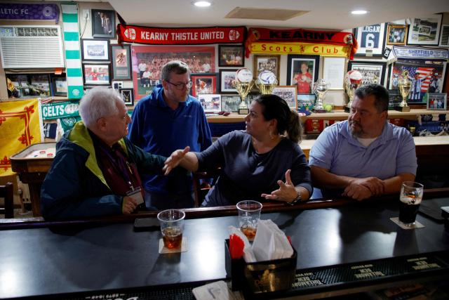 (L-R) Gerald Ficeto, Sean McDonald, Ann Rodrigues and Jose Rodrigues at the Scots American Club in Kearny, New Jersey on May 9, 2026. Anthony Duro had hoped the World Cup coming to his soccer-mad New Jersey town would mean watching games at nearby MetLife Stadium, but sky-high ticket prices are beyond his budget. (Photo by Leonardo MUNOZ / AFP) / TO GO WITH AFP STORY BY BEN TURNER