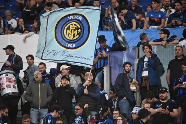 Inter fans wait for the start of the Italian Cup (Coppa Italia) final football match between Lazio Rome and Inter Milan at the Olympic stadium in Rome on May 13, 2026. (Photo by Isabella BONOTTO / AFP)