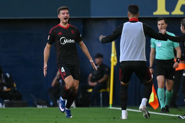 Sevilla's Spanish defender #04 Kike Salas celebrates scoring his team's second goal during the Spanish league football match between Villarreal CF and Sevilla FC at La Ceramica Stadium in Vila-real on May 12, 2026. (Photo by JOSE JORDAN / AFP)