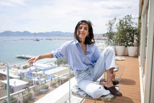 French director Charline Bourgeois-Tacquet poses for a portrait on the 'Terrasse by Albane' located on the roof of The JW Marriott Cannes hotel on the sidelines of the 79th edition of the Cannes Film Festival in Cannes, southern France, on May 13, 2026. (Photo by Anna KURTH / AFP)