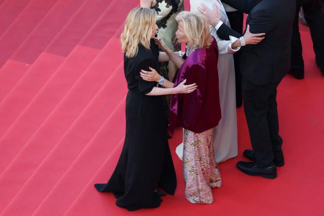 French actress Lea Drucker speaks with German media executive and President of the Cannes Film Festival Iris Knobloch as they arrive for the screening of the film "La Vie d'une femme" (A Woman's Life) at the 79th edition of the Cannes Film Festival in Cannes, southern France on May 13, 2026. (Photo by Sameer AL-DOUMY / AFP)