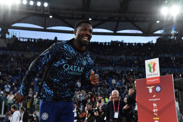 Inter Milan's French forward #09 Marcus Thuram enters the pitch during the players' presentation ahead of the Italian Cup (Coppa Italia) final football match between Lazio Rome and Inter Milan at the Olympic stadium in Rome on May 13, 2026. (Photo by Isabella BONOTTO / AFP)