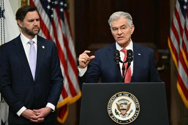 (L/R) US Vice President JD Vance looks on as Administrator for the Centers for Medicare and Medicaid Services Mehmet Oz speaks during a press conference on anti-fraud initiatives at the Eisenhower Executive Office building on the White House campus in Washington, DC, on May 13, 2026. (Photo by Kent NISHIMURA / AFP)