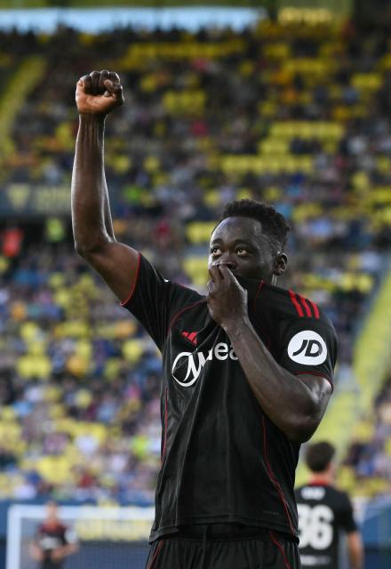 Sevilla's Nigerian forward #09 Akor Jerome Adams celebrates scoring his team's third goal during the Spanish league football match between Villarreal CF and Sevilla FC at La Ceramica Stadium in Vila-real on May 12, 2026. (Photo by JOSE JORDAN / AFP)