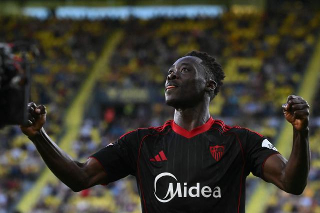 Sevilla's Nigerian forward #09 Akor Jerome Adams celebrates scoring his team's third goal during the Spanish league football match between Villarreal CF and Sevilla FC at La Ceramica Stadium in Vila-real on May 12, 2026. (Photo by JOSE JORDAN / AFP)