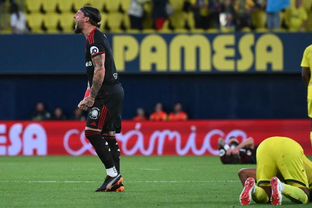 Sevilla's Serbian midfielder #06 Nemanja Gudelj reacts at the end of the Spanish league football match between Villarreal CF and Sevilla FC at La Ceramica Stadium in Vila-real on May 12, 2026. (Photo by JOSE JORDAN / AFP)