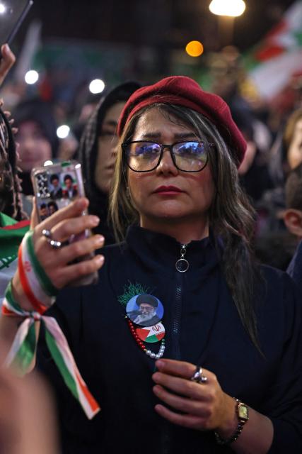 People gather to attend the farewell ceremony of Iran's national football team ahead of their departure for the 2026 FIFA World Cup, in Tehran on May 13, 2026. The president of the Iranian Football Federation said late May 9 that if Iran dropped out of the World Cup, it would deprive the country of a "major diplomatic asset". World football's governing body FIFA has insisted for weeks that Iran will take part. Iran, who are due to be based in Tucson, Arizona, during the World Cup, face New Zealand, Belgium and Egypt in Group G. The Iranians open their World Cup campaign against New Zealand in Los Angeles on June 15. (Photo by ATTA KENARE / AFP)