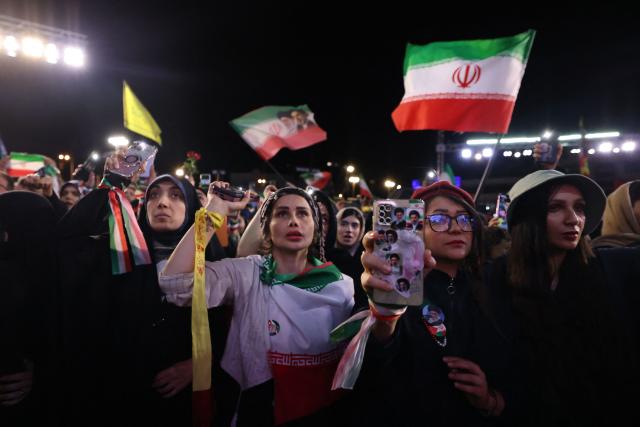 People gather to attend the farewell ceremony of Iran's national football team ahead of their departure for the 2026 FIFA World Cup, in Tehran on May 13, 2026. The president of the Iranian Football Federation said late May 9 that if Iran dropped out of the World Cup, it would deprive the country of a "major diplomatic asset". World football's governing body FIFA has insisted for weeks that Iran will take part. Iran, who are due to be based in Tucson, Arizona, during the World Cup, face New Zealand, Belgium and Egypt in Group G. The Iranians open their World Cup campaign against New Zealand in Los Angeles on June 15. (Photo by ATTA KENARE / AFP)