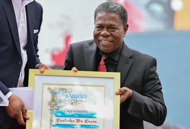Brazilian percussionist Paulinho da Costa holds a frame during his Walk of Fame star ceremony in Hollywood, California on May 13, 2026. (Photo by Frederic J. Brown / AFP)